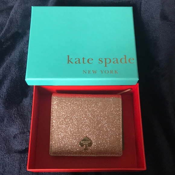 kate spade Handbags - NWT Kate Spade Rosegold Glitter Wallet